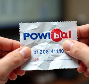 Close-up of winning Powerball lottery ticket with official logo visible.